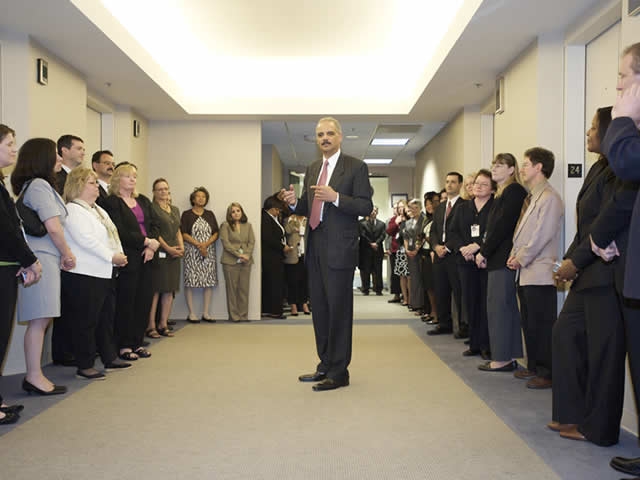 Justice Department official speaking with employees inside Executive Office for Immigration Review offices