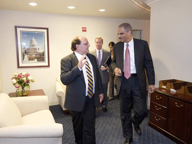 Justice Department officials walking through Executive Office for Immigration Review offices
